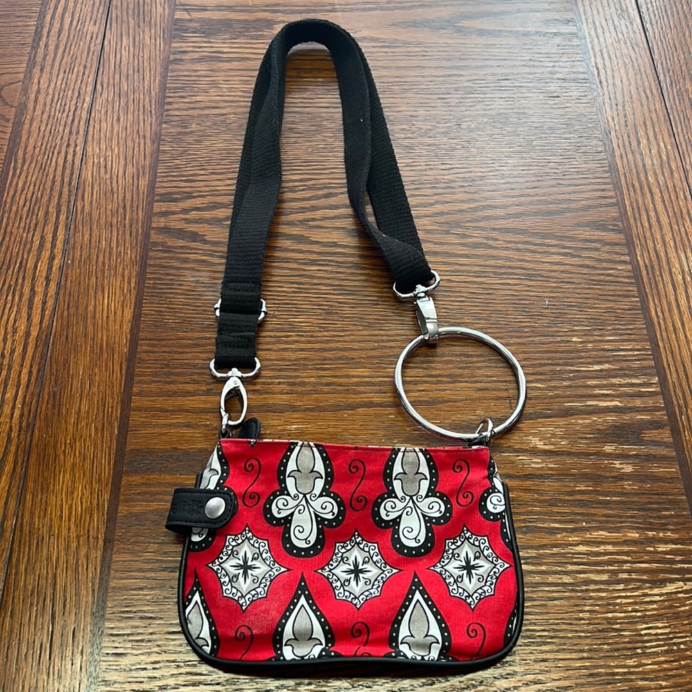Luvali Convertables Wristlet with adjustable strap .